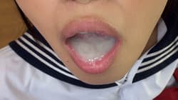 Asian plays with cum in her mouth'